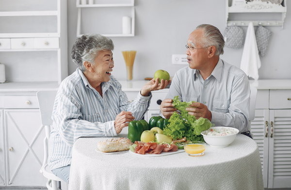 Image of elderly couple enjoying food