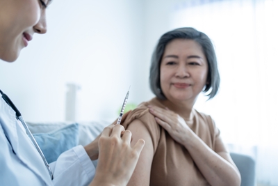 Image of doctor giving treatment to a woman