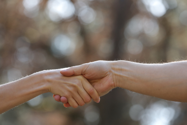 Image of Holding Hand and Providing Charity Assistance