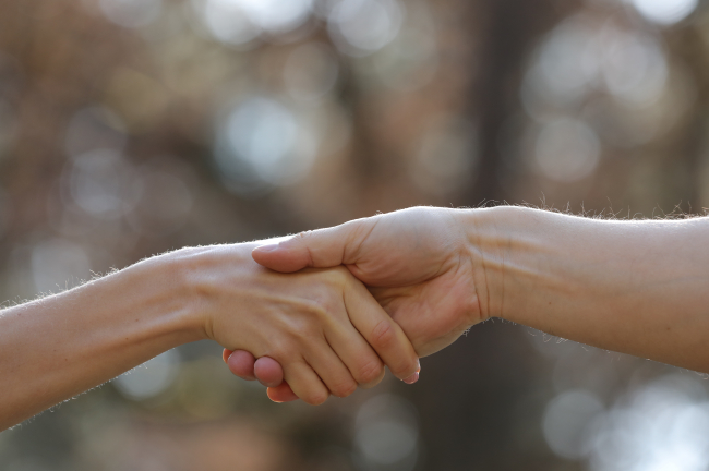 Image of Holding Hand and Providing Charity Assistance